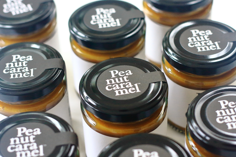 A photo of jars of Peanut Caramel taken from above, showing the lids